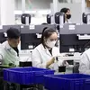 Mitarbeiter im Werk von AJAX Systems in Vietnam