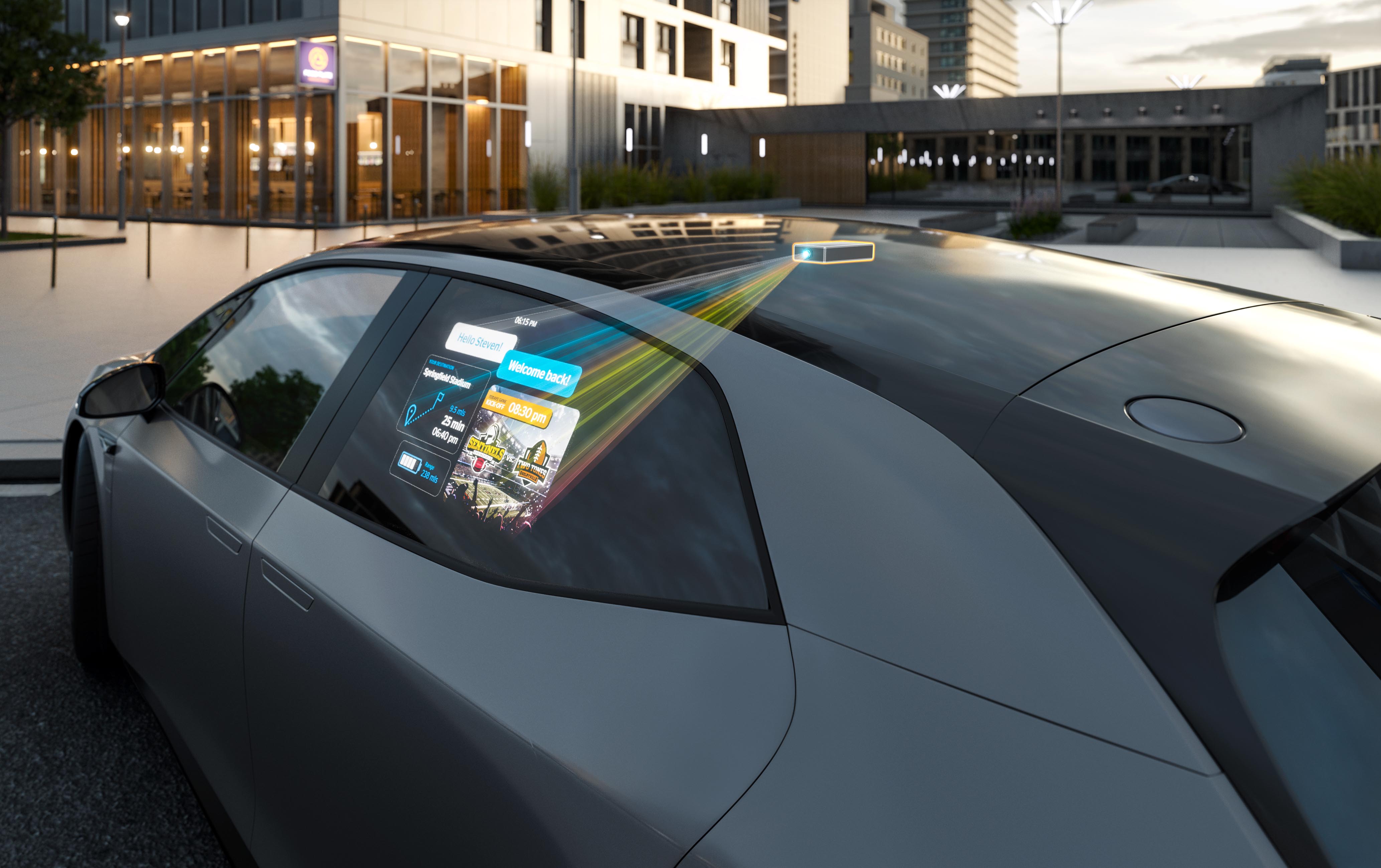 Projektionseinheit des "Window Projection"-Systems Mini-Projektor zeigt das Bild auf der Seitenscheibe des Autos